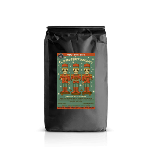 Cracked Nut Conspiracy by Frenzy Bones — hazelnut flavored coffee. Nutcracker skeleton art.